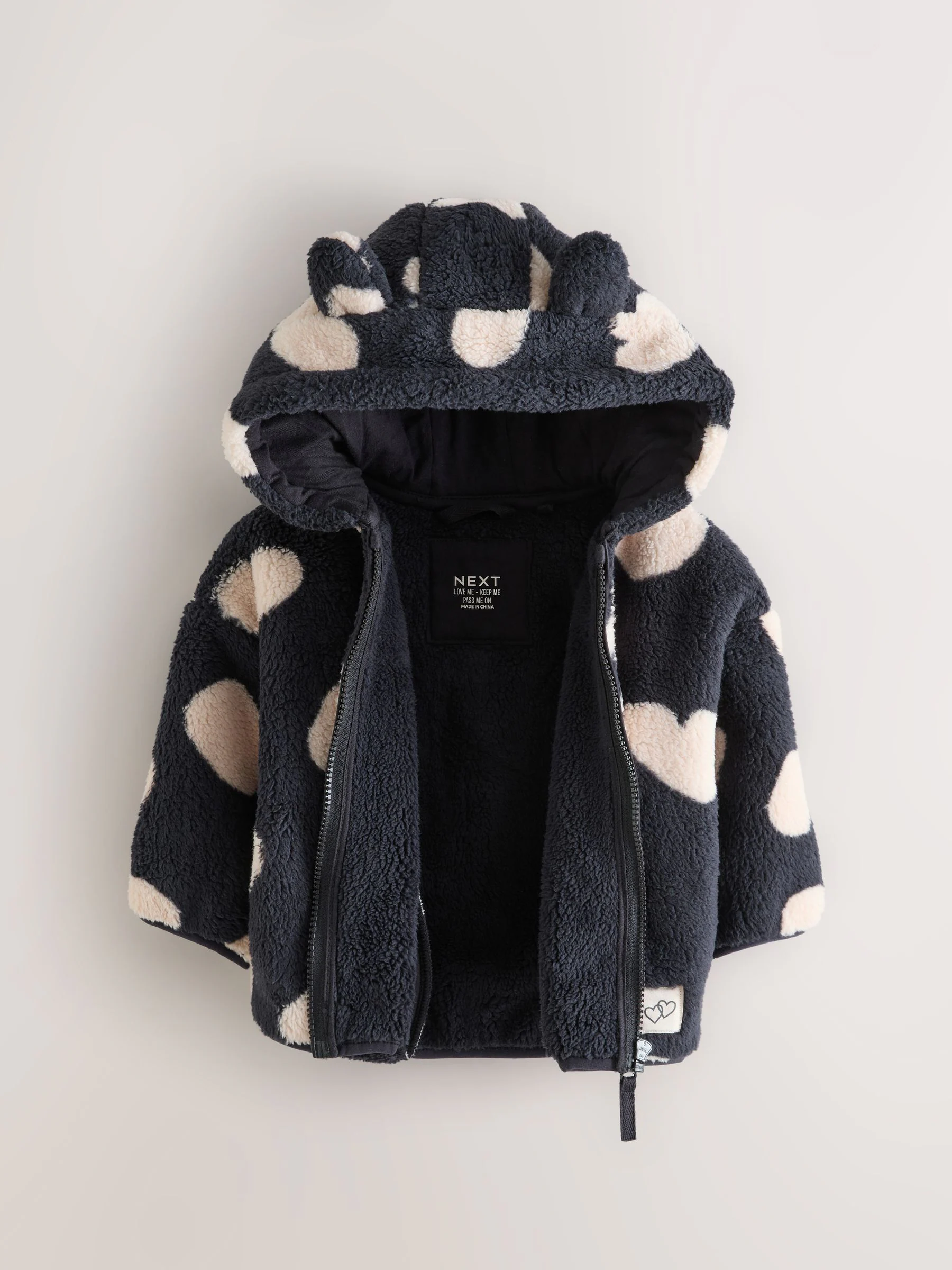 Zwart met hartjesprint - Fleece met ritssluiting (3mnd-7jr)