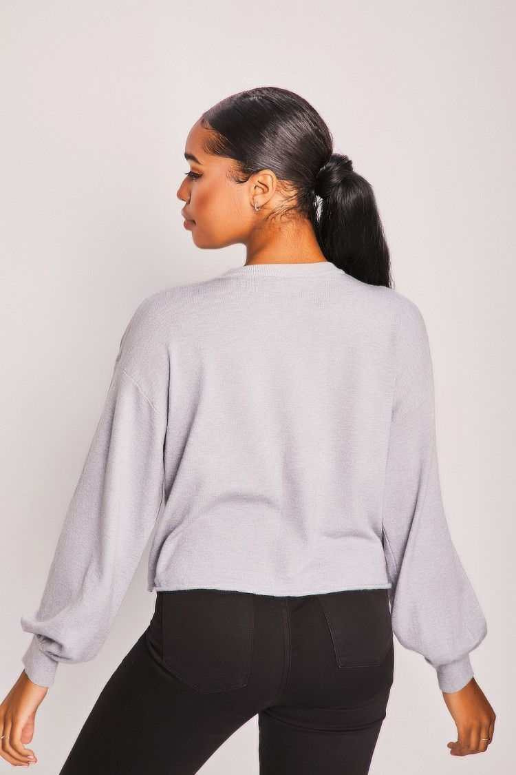 Pull gris tête de femme