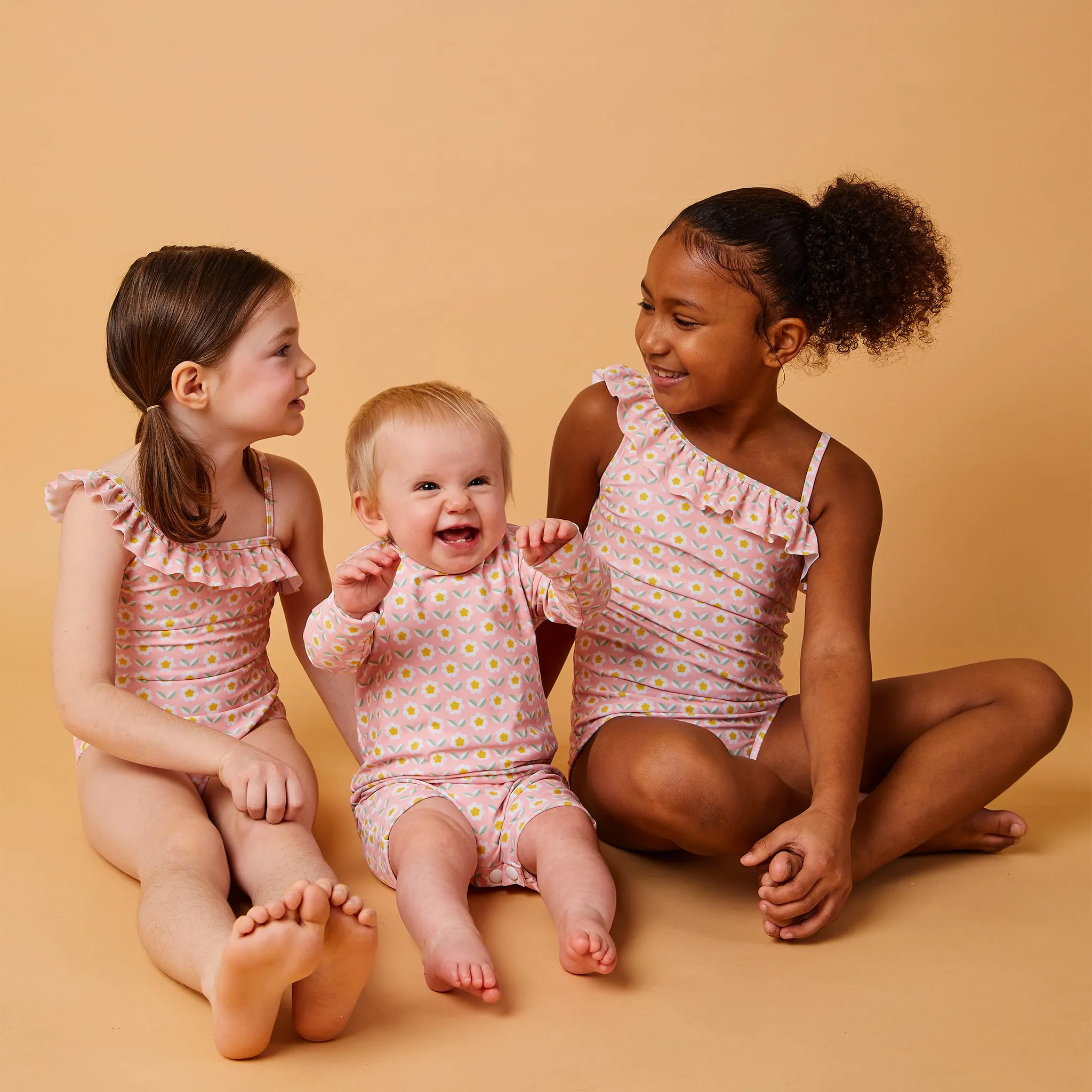 Nana The Brand Maillot UV Manches Longues Pinky Flowers 3-24mois