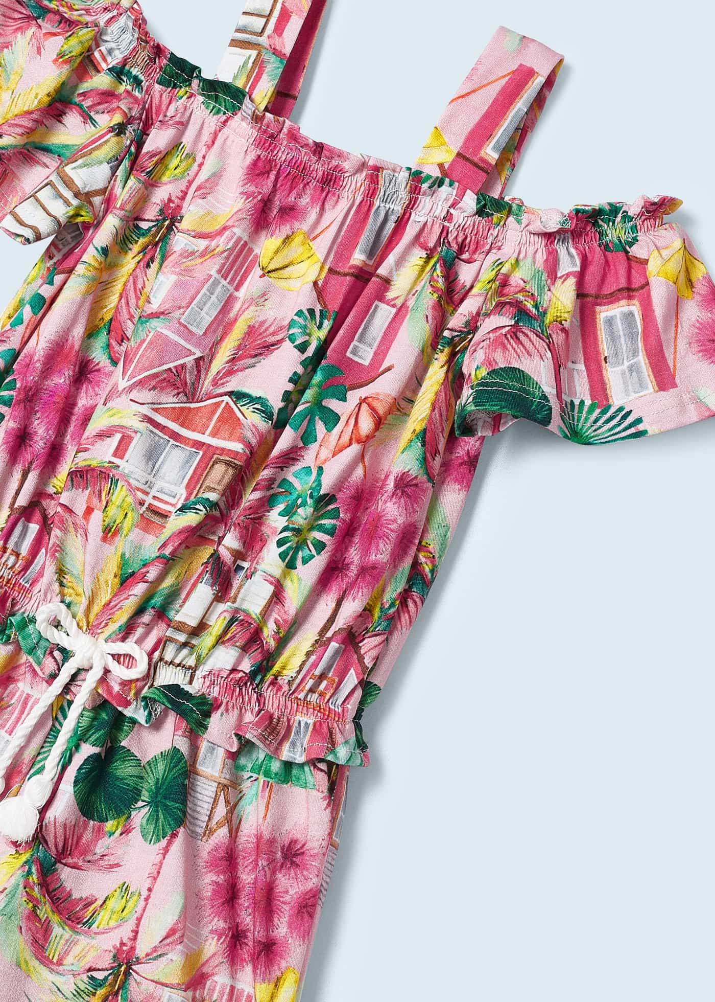 Macacão curto estampado para meninas, feito de algodão sustentável.