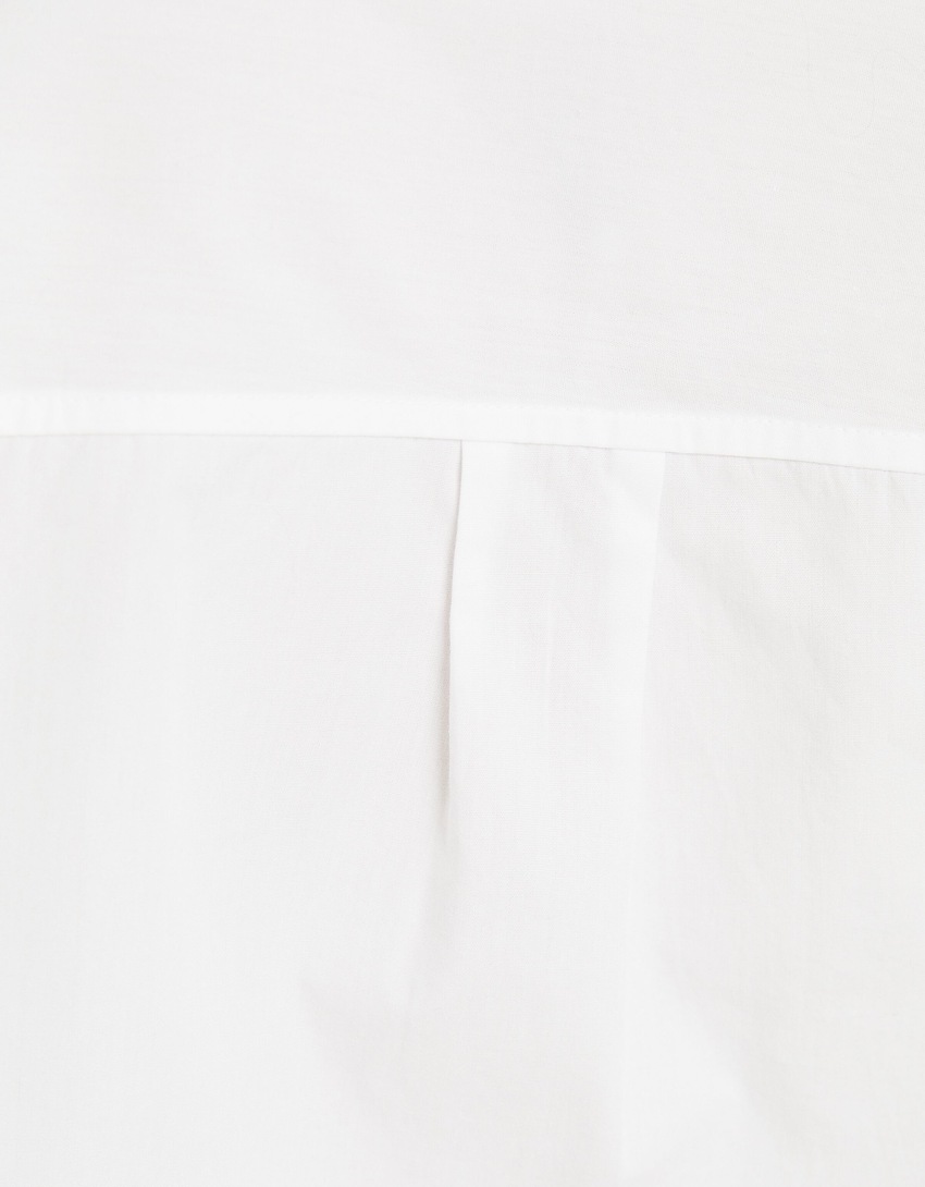 Camisa cropped de popeline de manga comprida com alças.