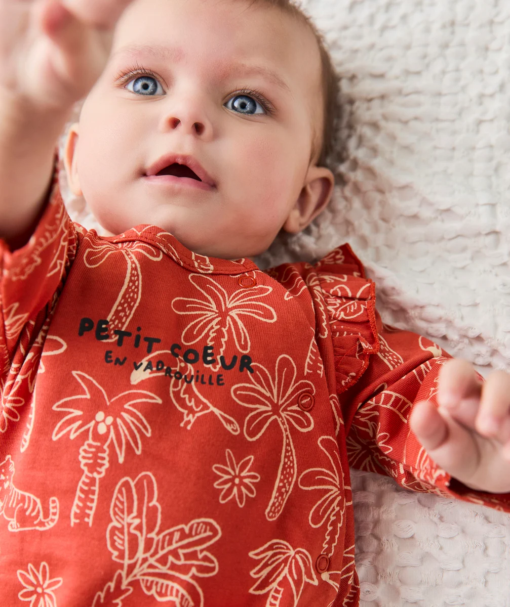 dors-bien bébé en coton bio rouille avec imprimé palmiers et oiseaux