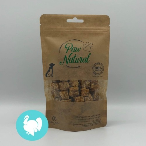 Cubos de ração Paw com sabor natural de peru para cães.