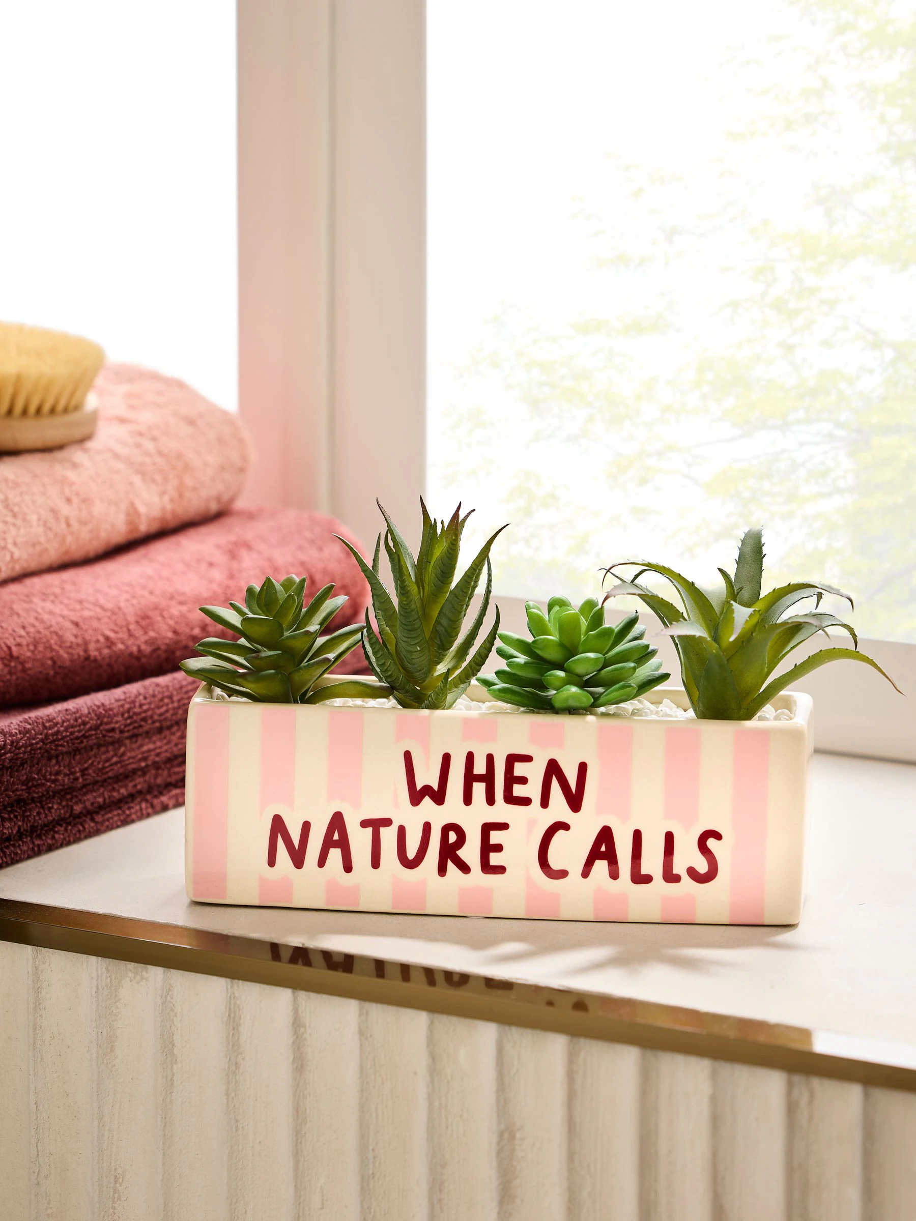Badkamerornamenten met Strepen slogan kunstplanten