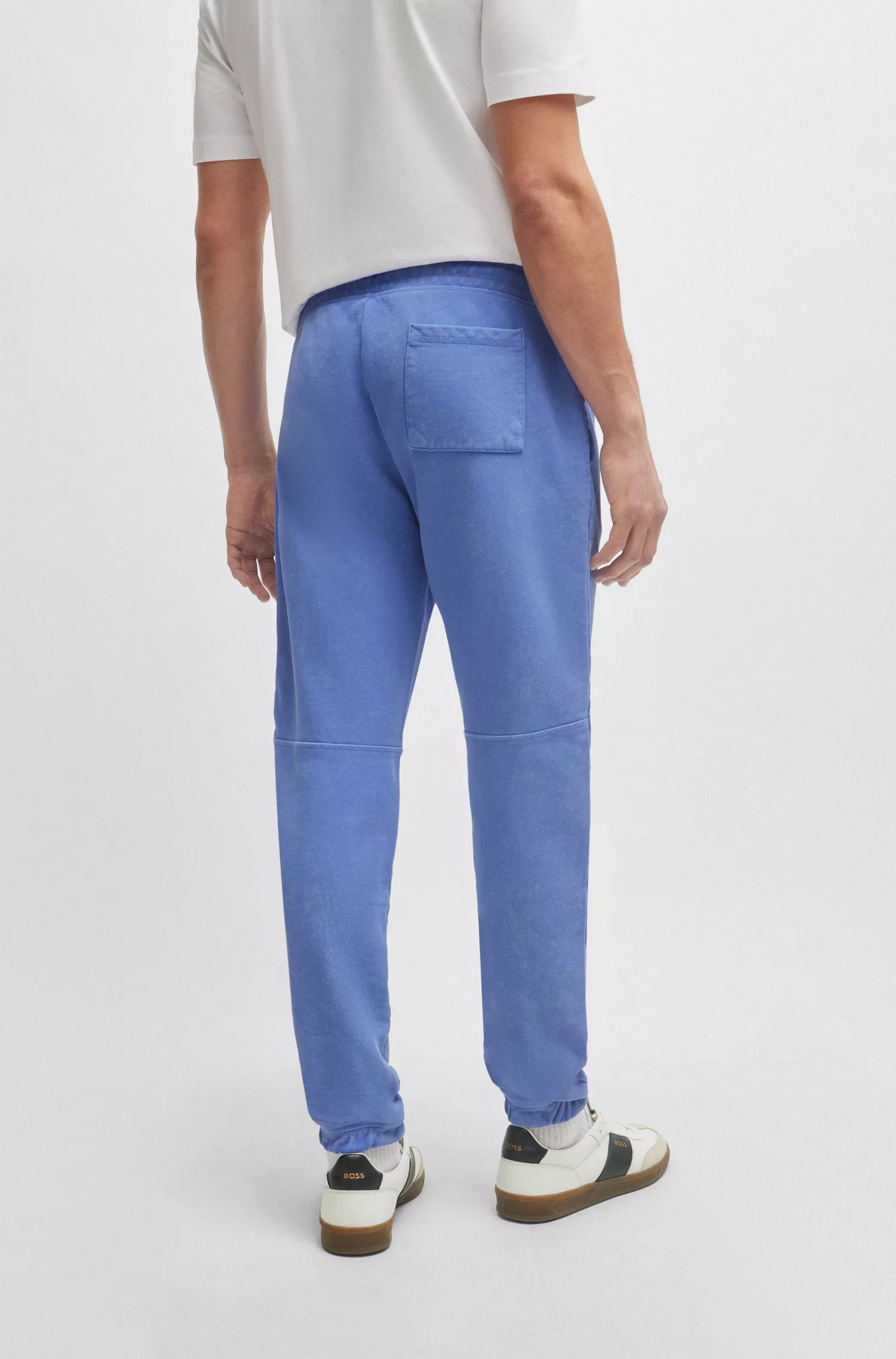 Calça de fato de treino BOSS em tecido atoalhado de algodão laranja com detalhe do logótipo