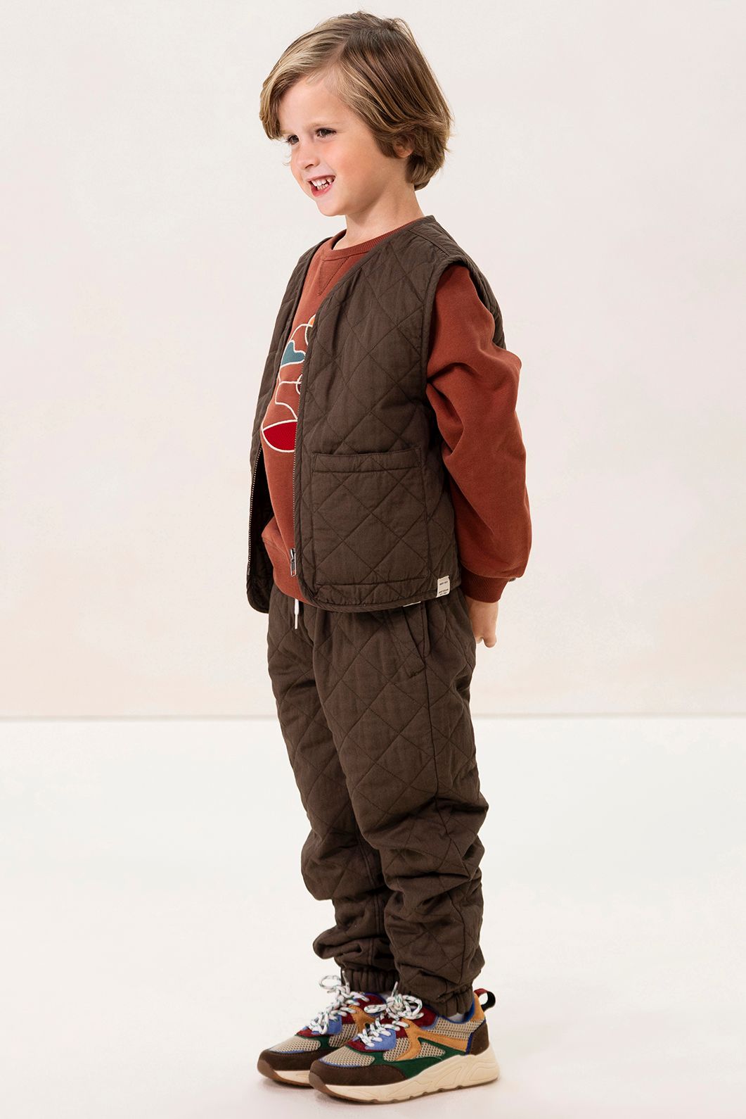 Donkergroen quilted gilet