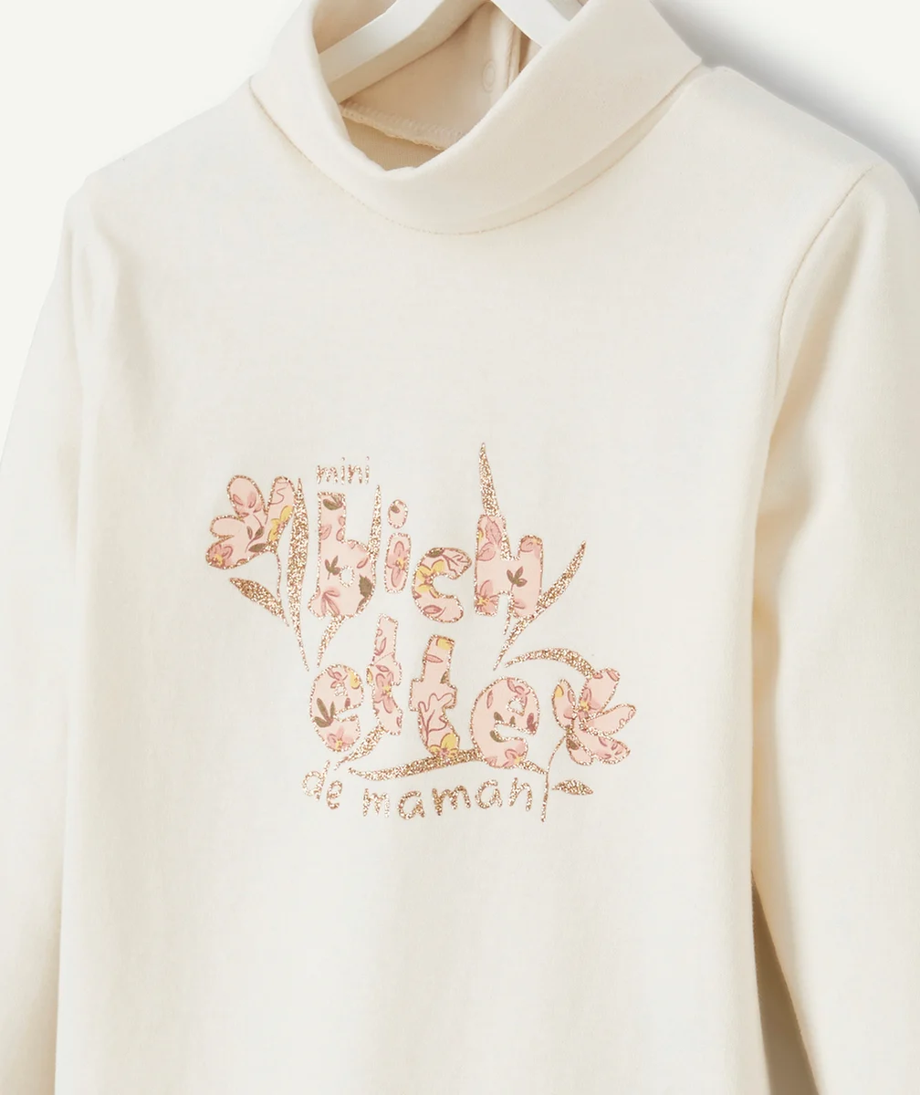 SOUS-PULL BÉBÉ FILLE COL ROULÉ EN COTON BIO ÉCRU ET MESSAGE PAILLETÉ