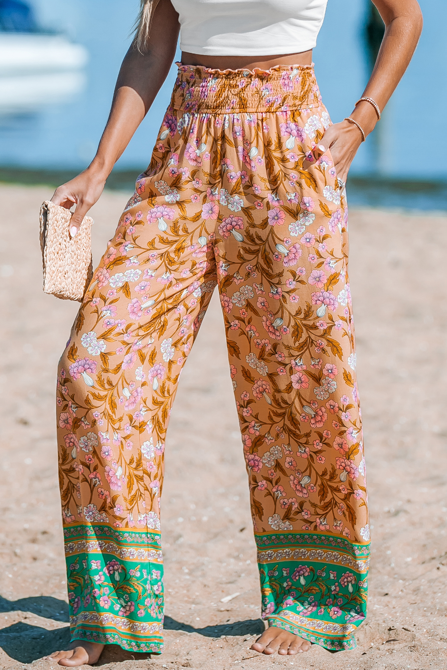 Pantalon fleuri avec jambes droites et taille à smocks orange