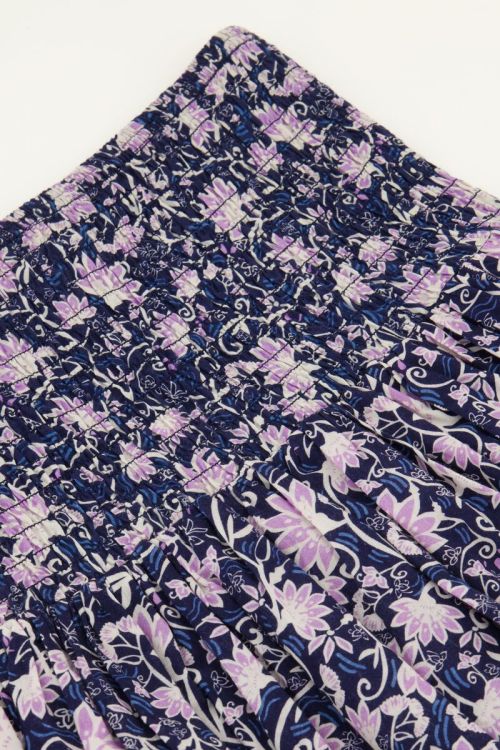 Blauw rokje met paarse bloemenprint