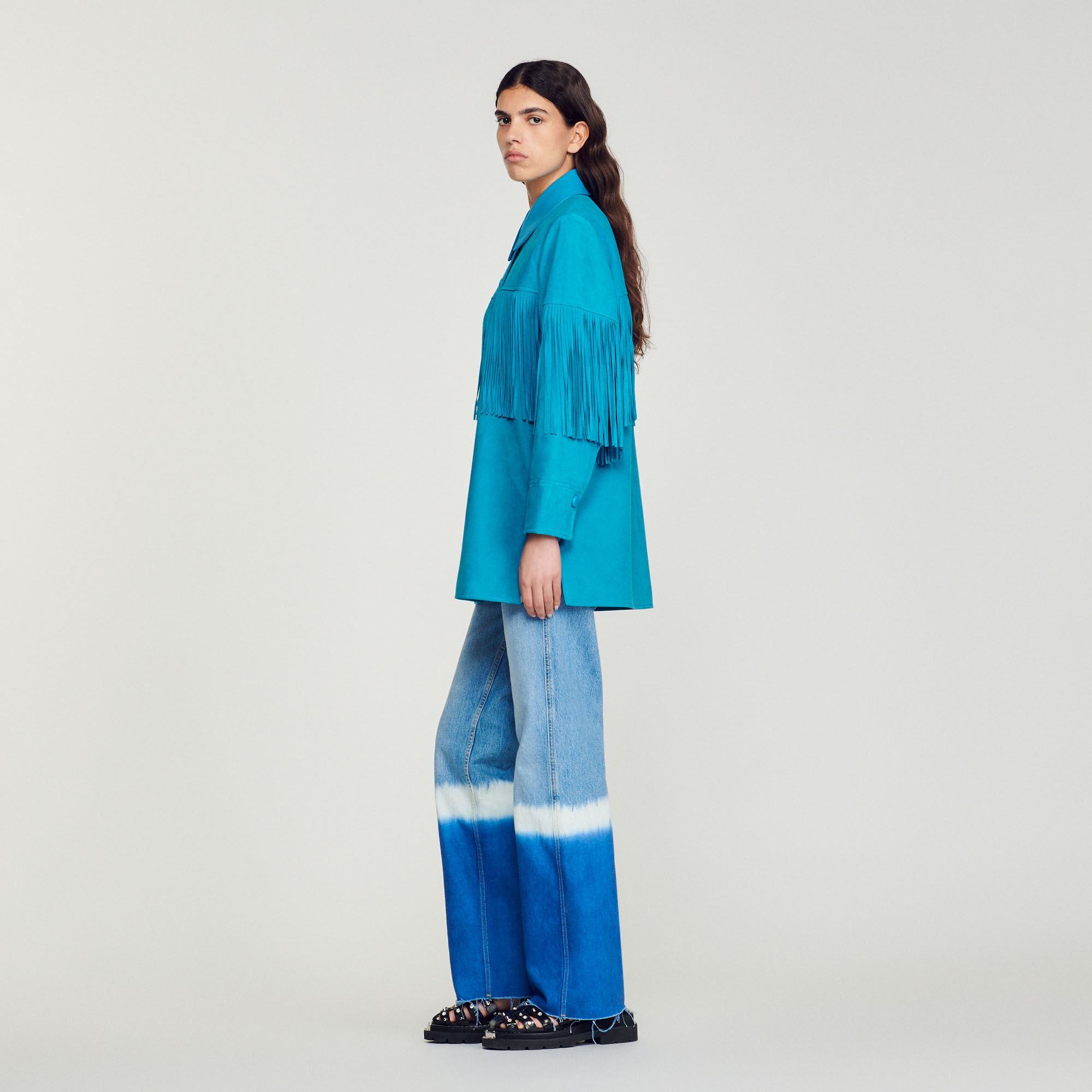 Veste longue en cuir á franges