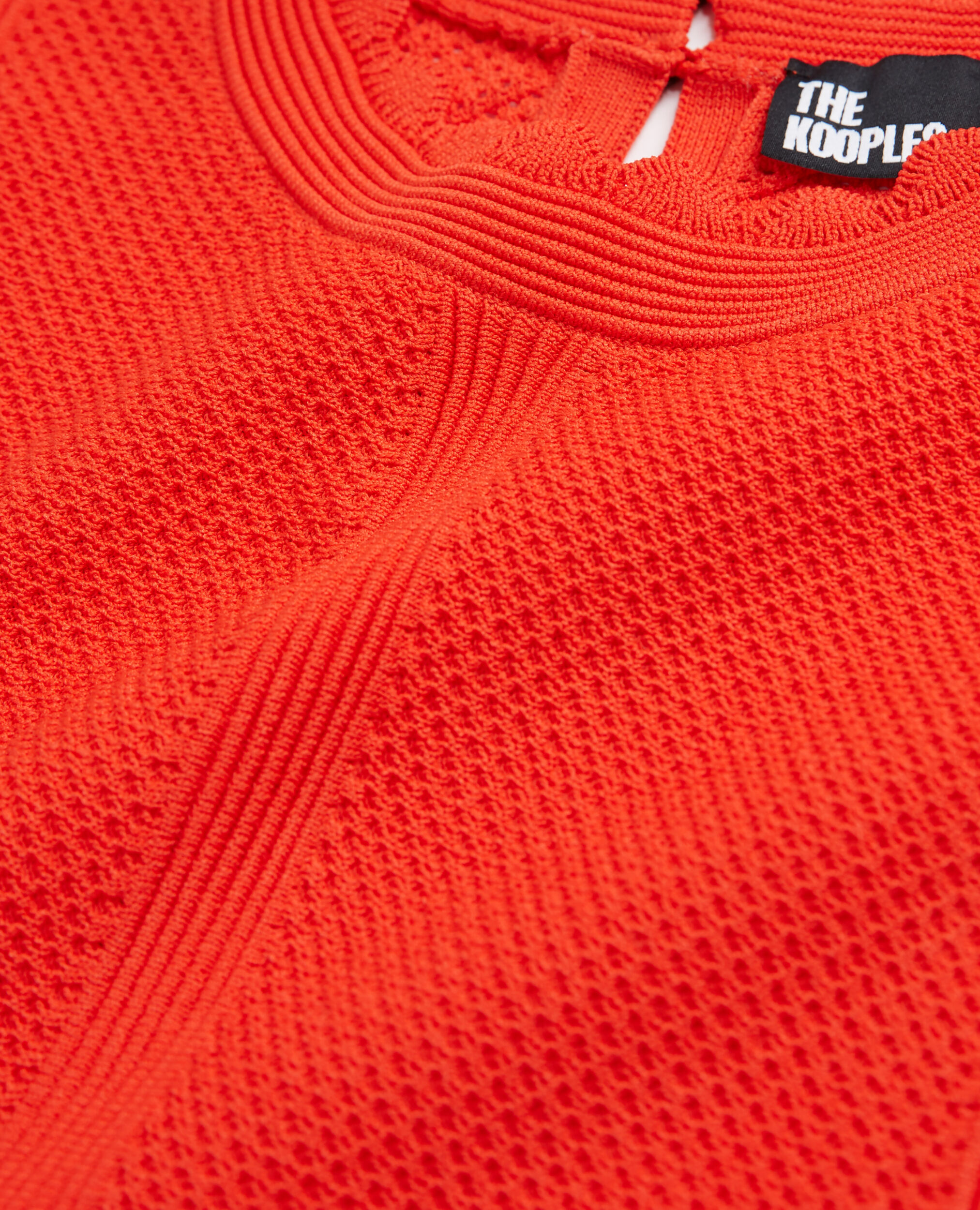 Top court orange en maille