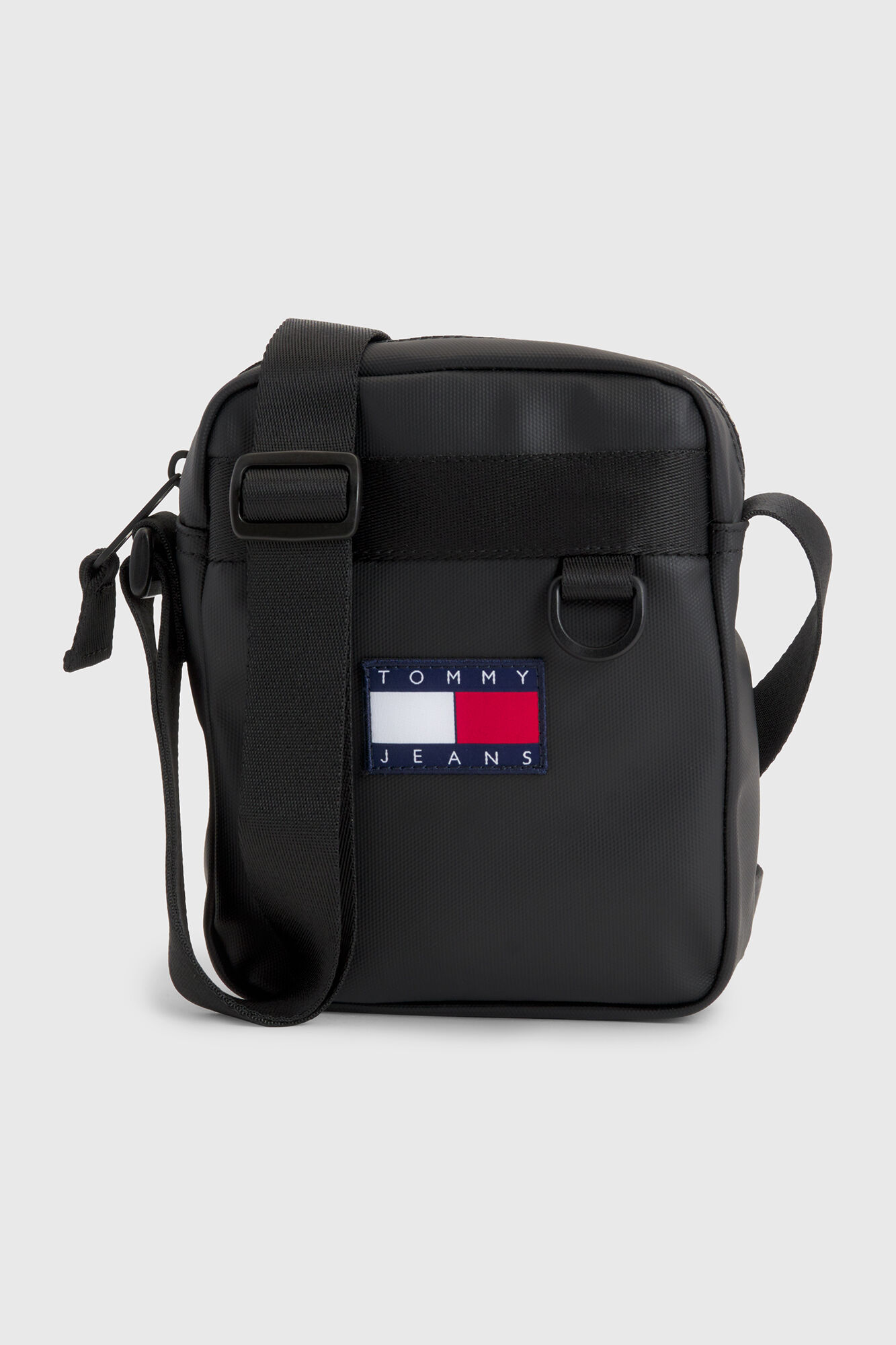 Bolsa de ombro masculina Tommy Jeans com bandeira.