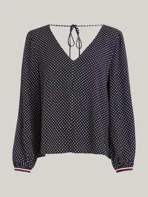 Blusa de bolinhas com decote em V e modelagem regular.
