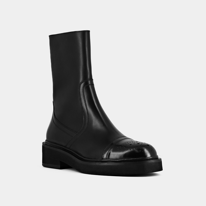 Bottines à empiecement et surpiqures  en cuir noir