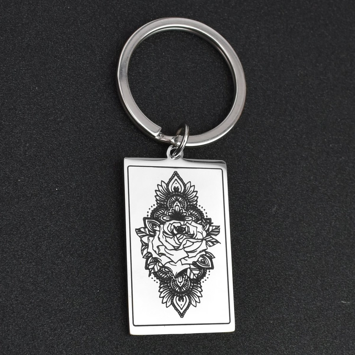 Porte-clés fleur de lotus dans un rectangle acier inoxydable
