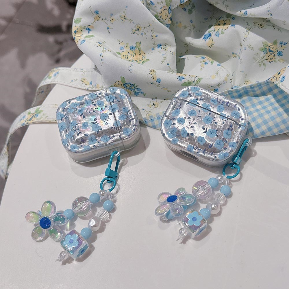 AirPods (1. & 2. Generation) Gummi Case Schutzhülle mit Handschlaufe Blumen Design - Blau / Transparent