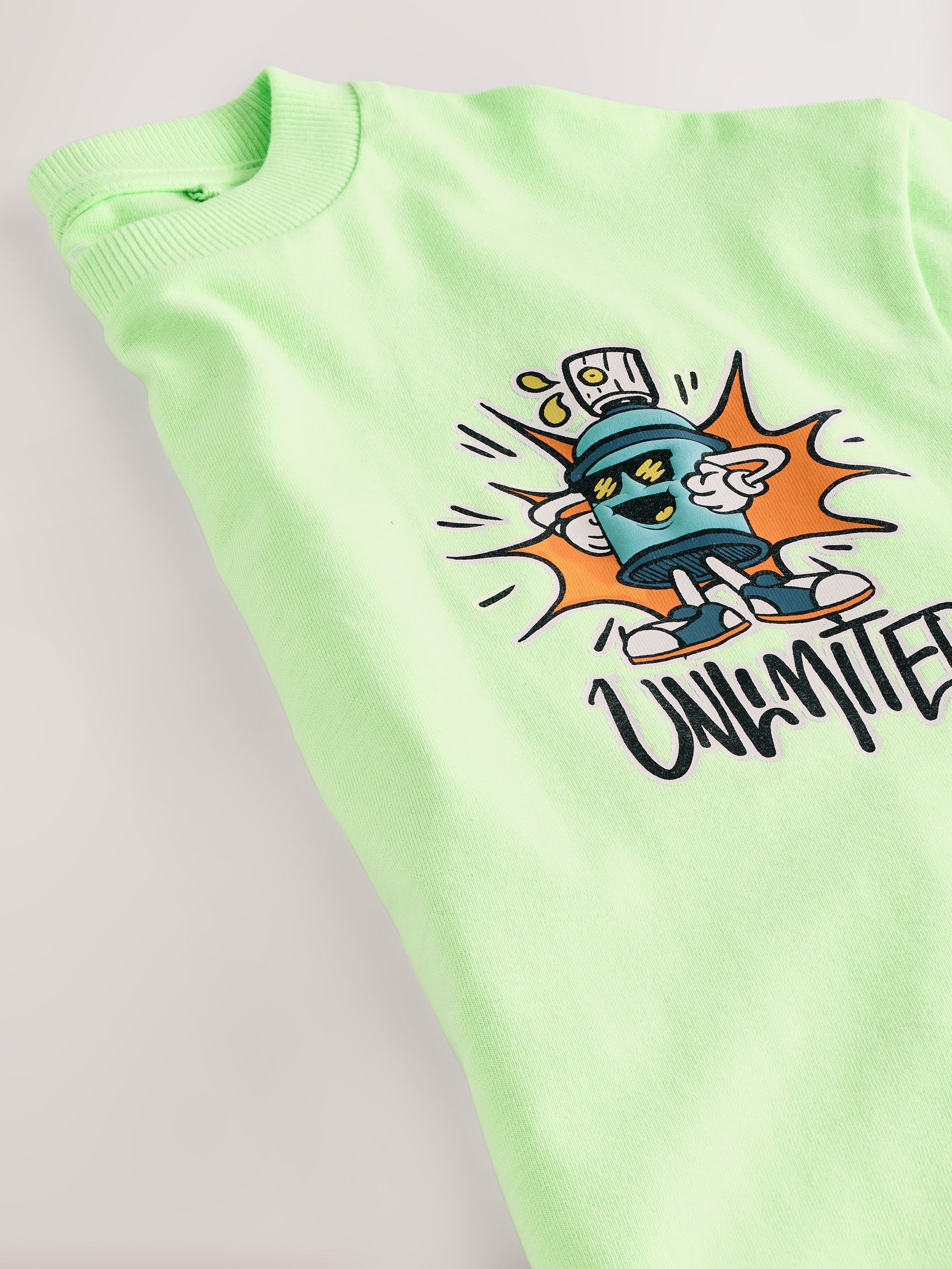 Limoengroene graffiti - Ruimvallend T-shirt met print en korte mouwen (3-16 jr)