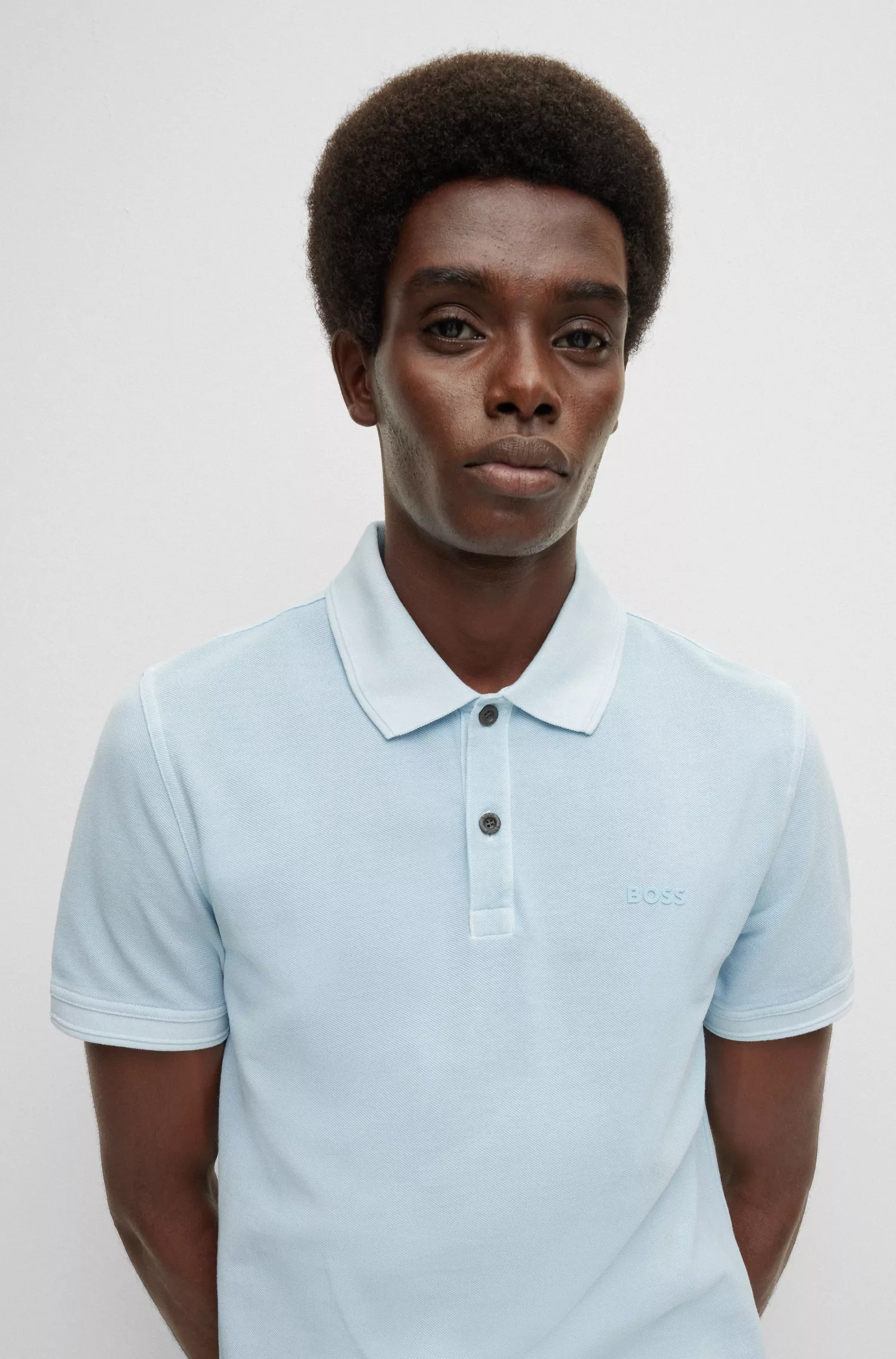 Camisa polo BOSS laranja, corte slim, em piqué de algodão.