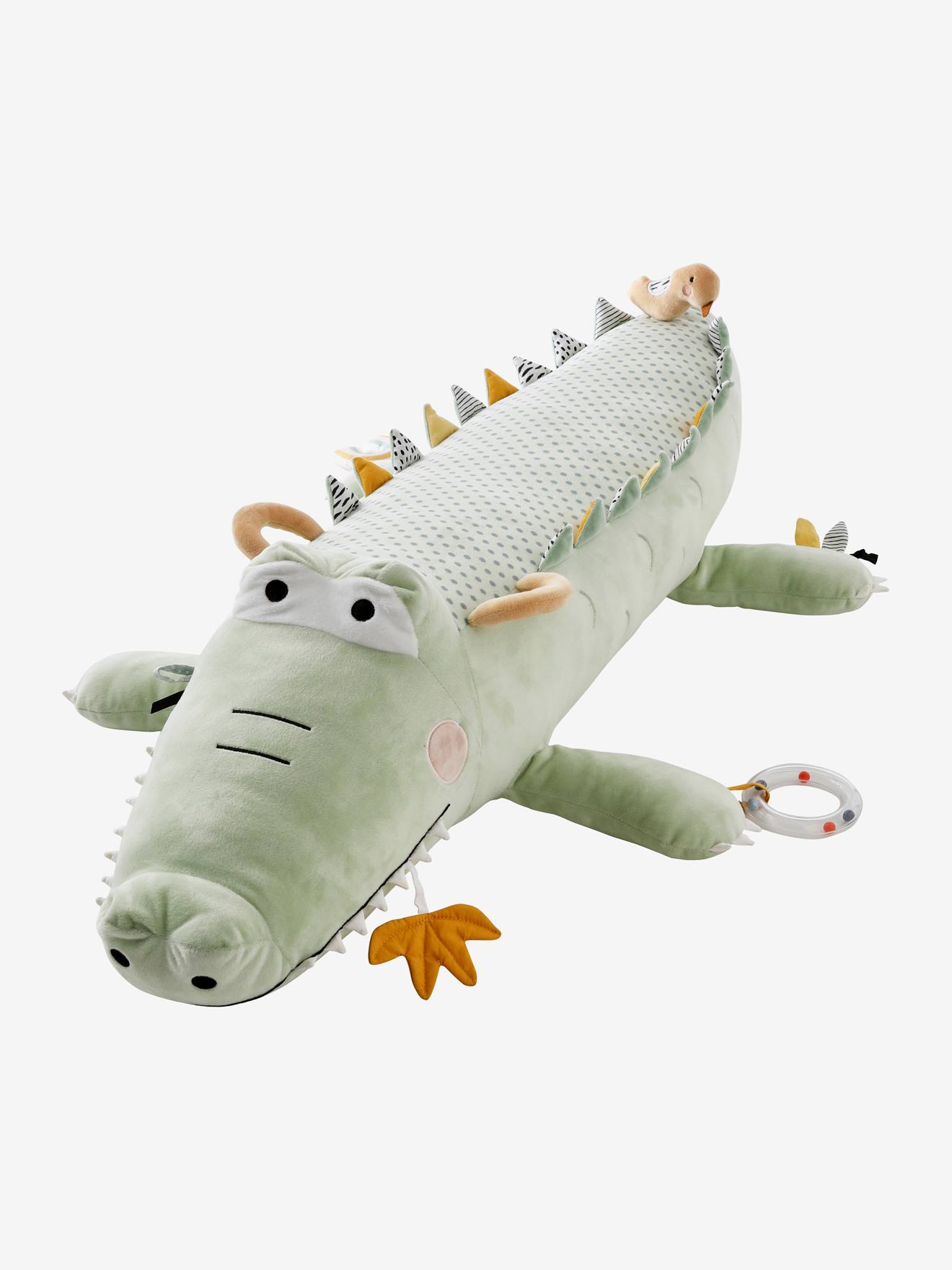 Brinquedo de pelúcia grande verde com tema de selva.