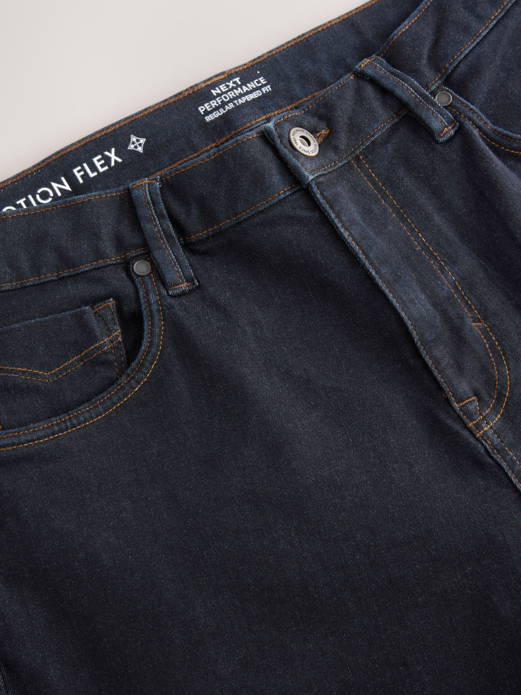 Blauw met wassing - Standaard toelopende pasvorm - Motionflex jeans