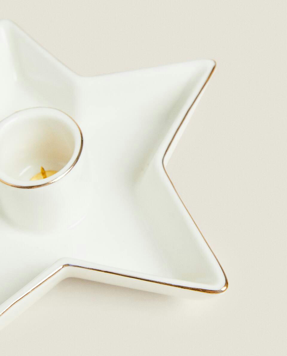 Castiçal grande em formato de estrela de Natal com borda