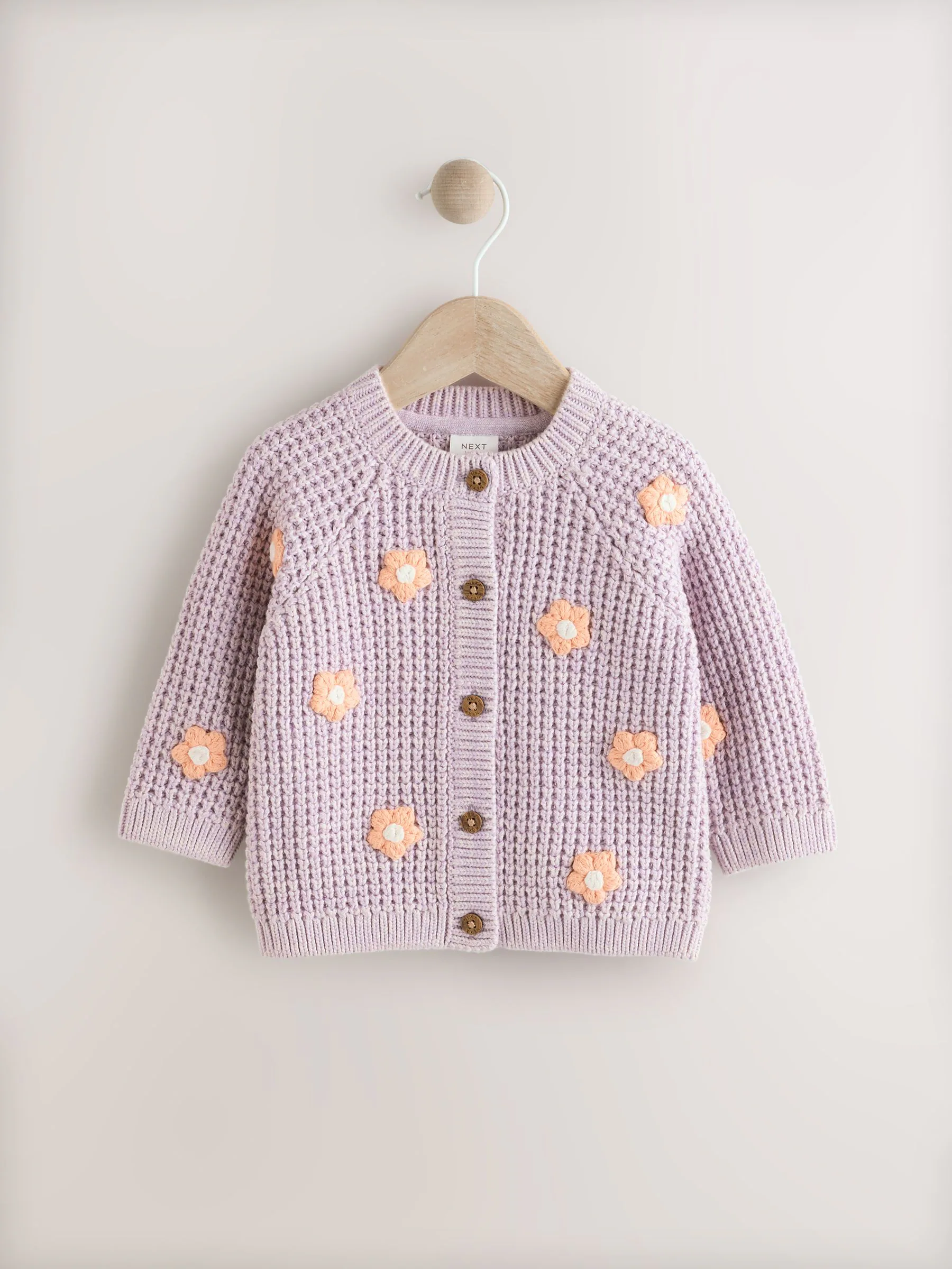 Paarse en abrikozenkleurige bloemen voor baby's - Geborduurd vest (0 mnd - 2 jr)