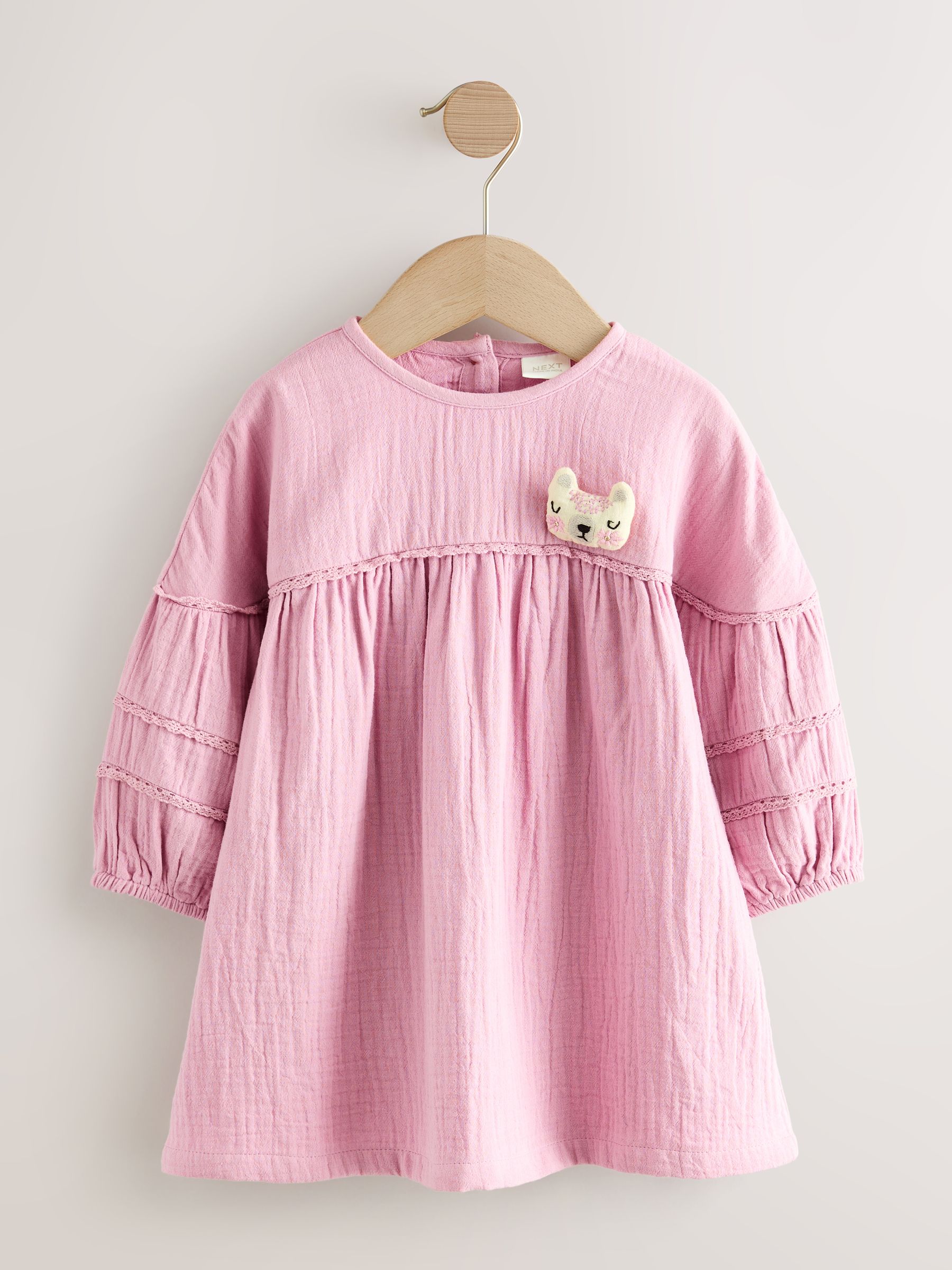 Roze met figuurtjes - Jurk met textuur (3 mnd - 8 jr)