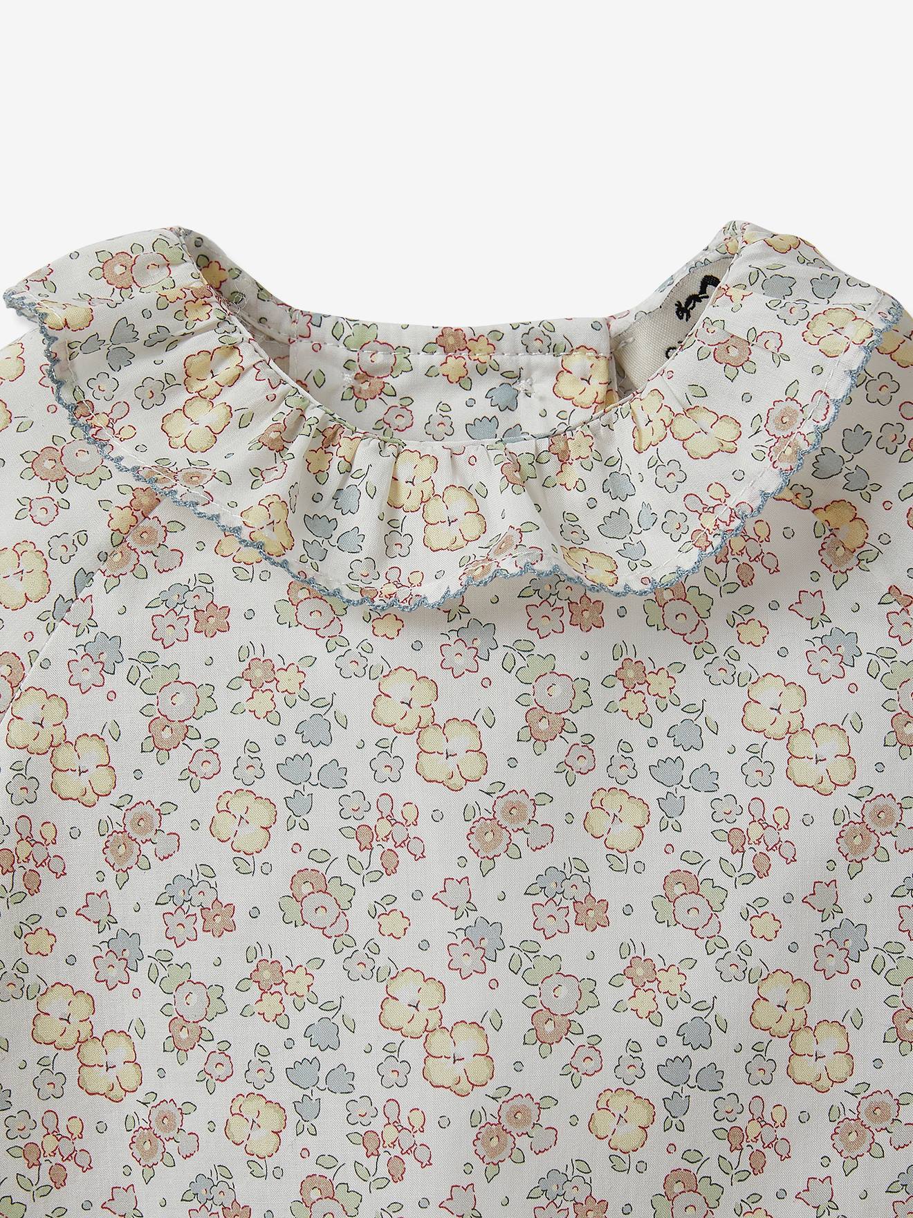 Blusa infantil Cyrillus em tecido Liberty com estampa branca clara.
