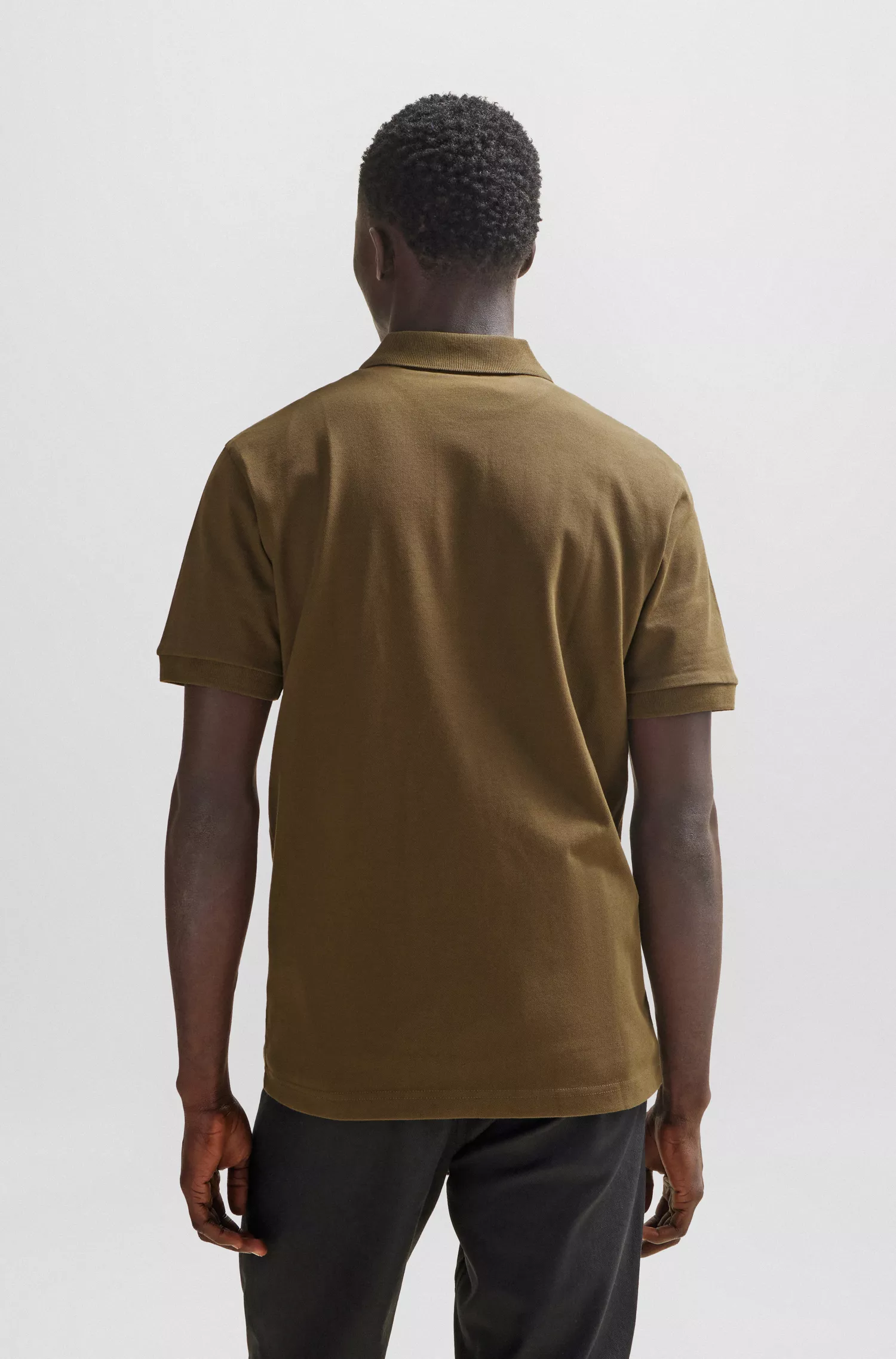 Camisa polo BOSS laranja, de algodão stretch, corte slim, com etiqueta de logotipo.