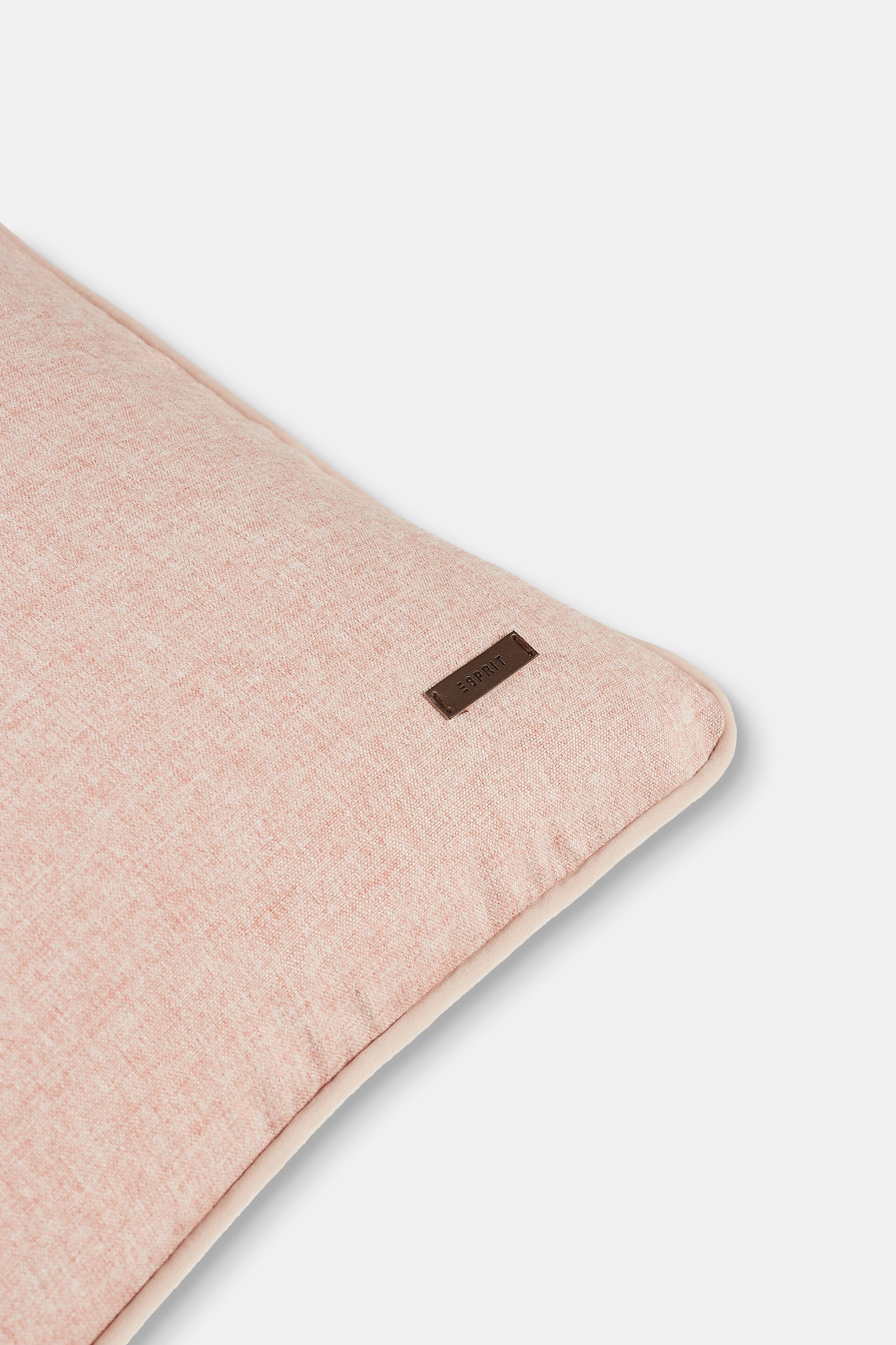Housse de coussin décorative rehaussée d’un passepoil en velours