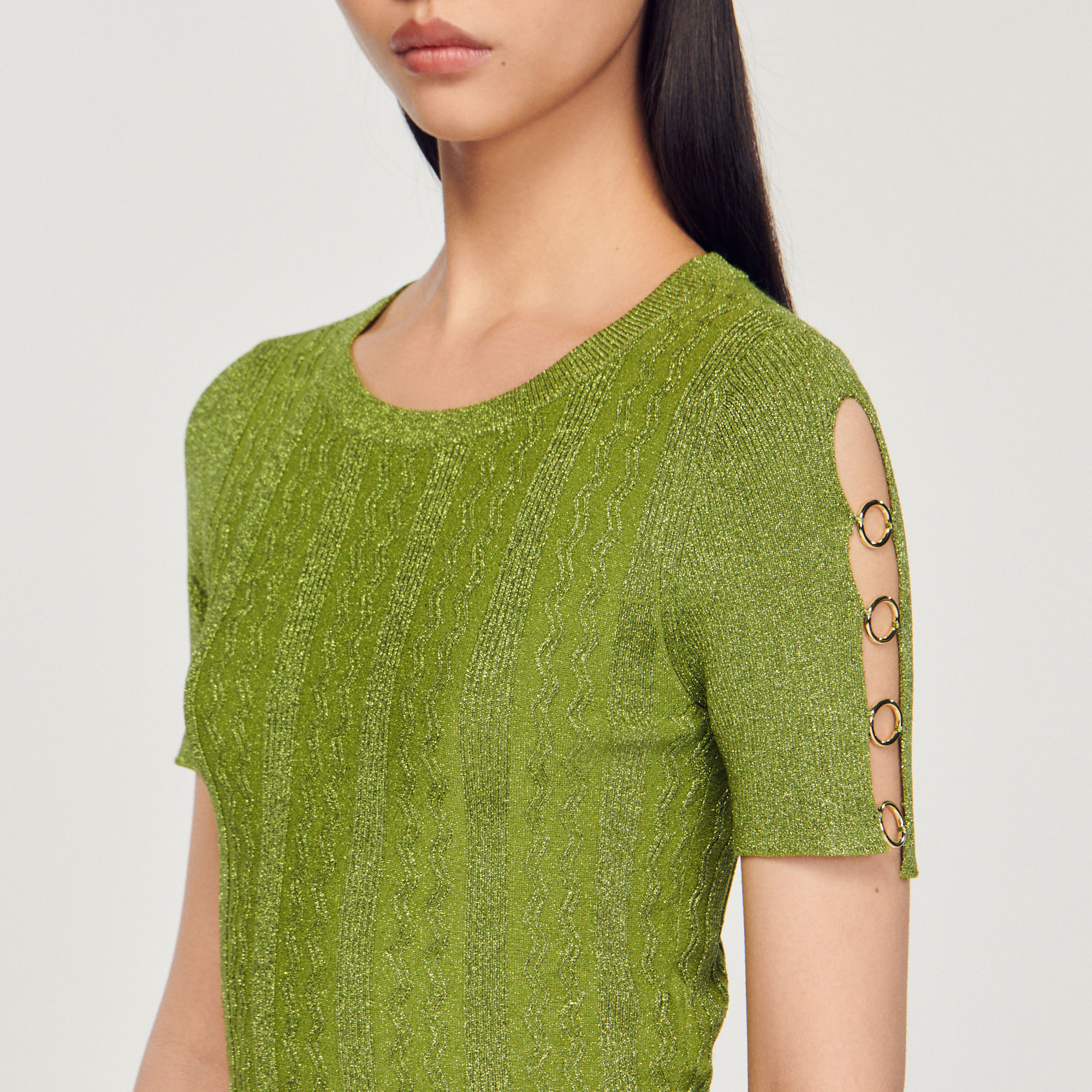 Pull court en maille metallisee
