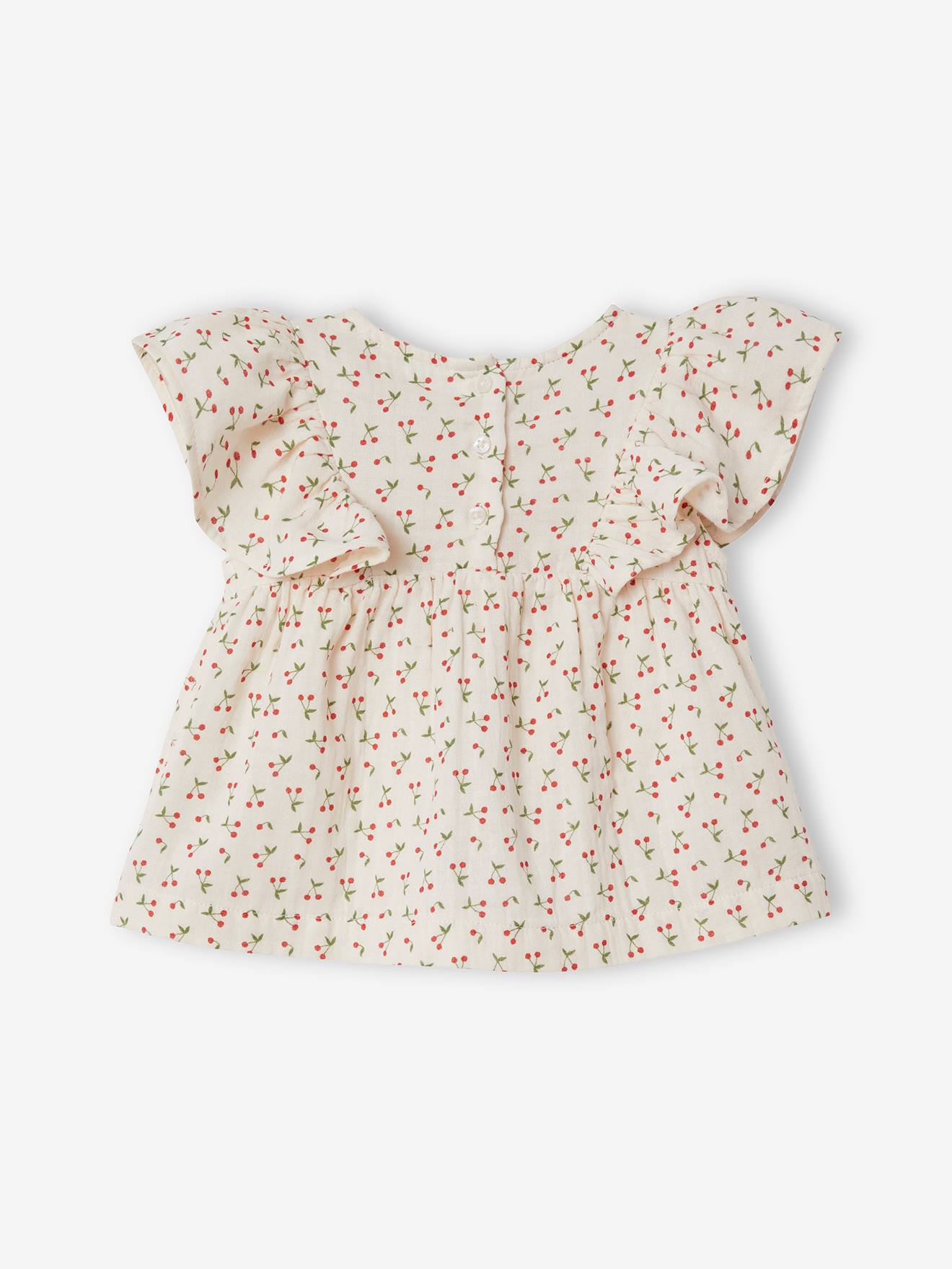 Blusa infantil azul acinzentada com babados.