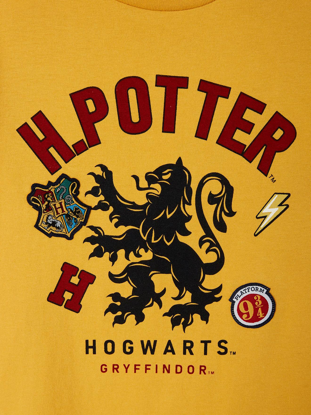 Camiseta Harry Potter®, amarela tamanho médio, lisa com estampa.