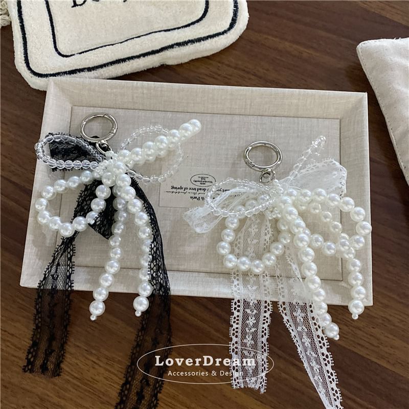 BeDaisy - Sleutelhanger met strik en imitatieparelkant