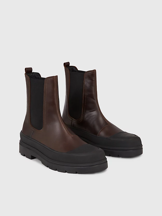 botas de couro até o tornozelo