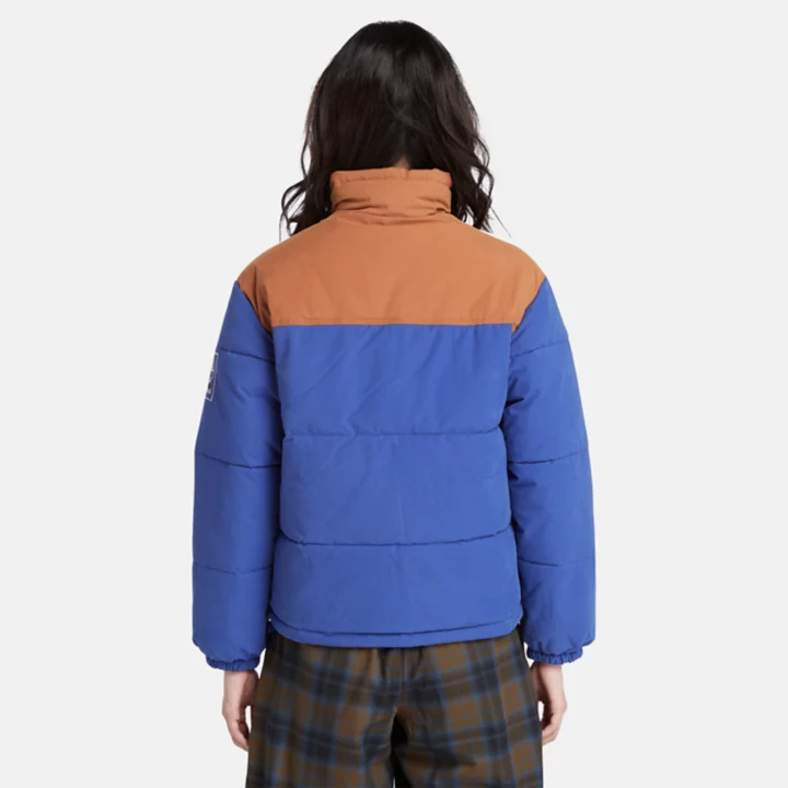 Jaqueta puffer feminina Mountain Welsh na cor azul.