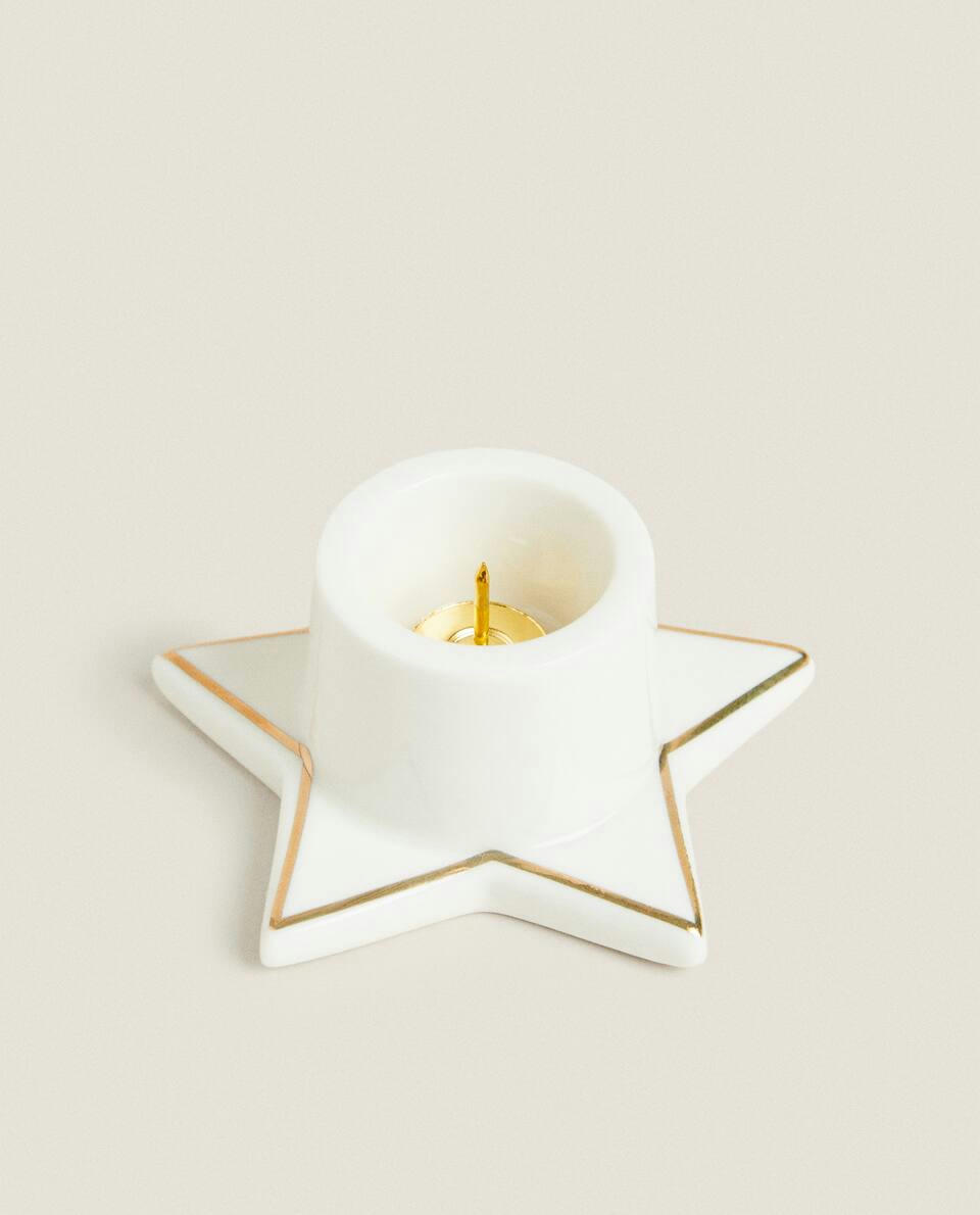 Castiçal pequeno em formato de estrela de Natal com borda