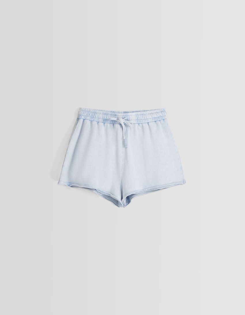 Shorts de pelúcia com efeito desbotado