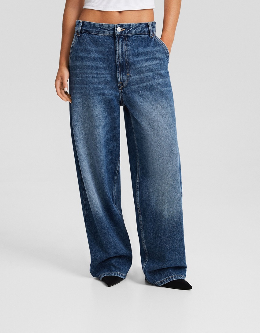 calça jeans estilo skater com efeito desbotado