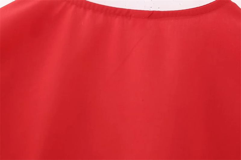Yukis - Blouse met korte mouwen en peplumstrik aan de voorkant