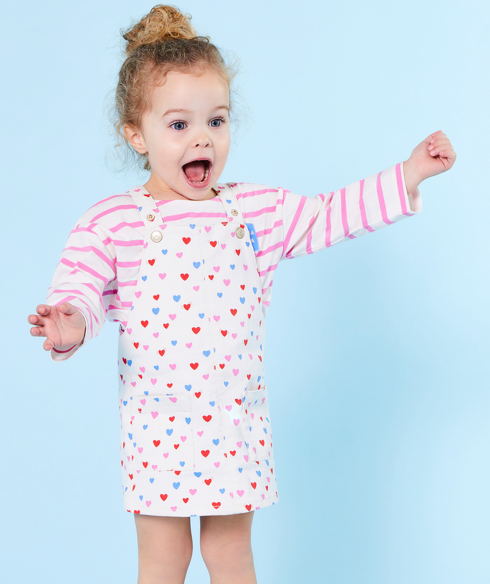 ROBE SALOPETTE BÉBÉ FILLE EN FIBRES RECYCLÉES ÉCRUE IMPRIMÉE COEUR COLORÉ