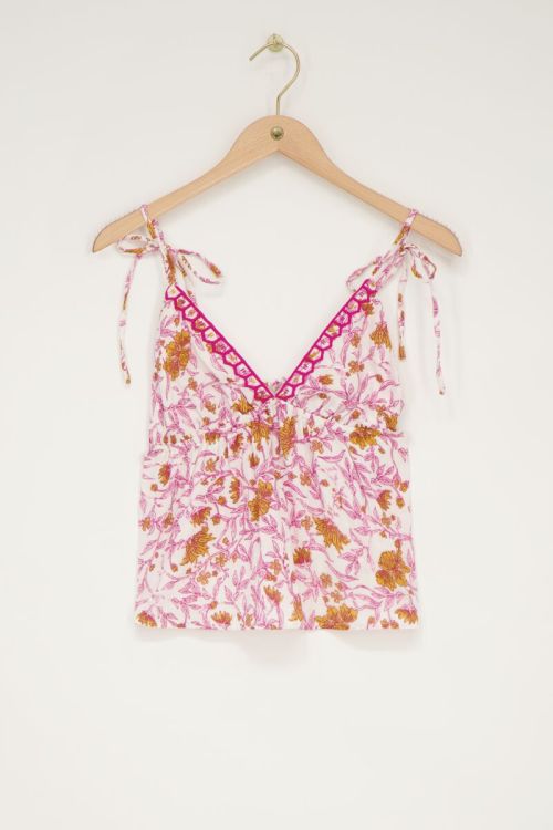 Witte top met roze bloemenprint en strikbandjes