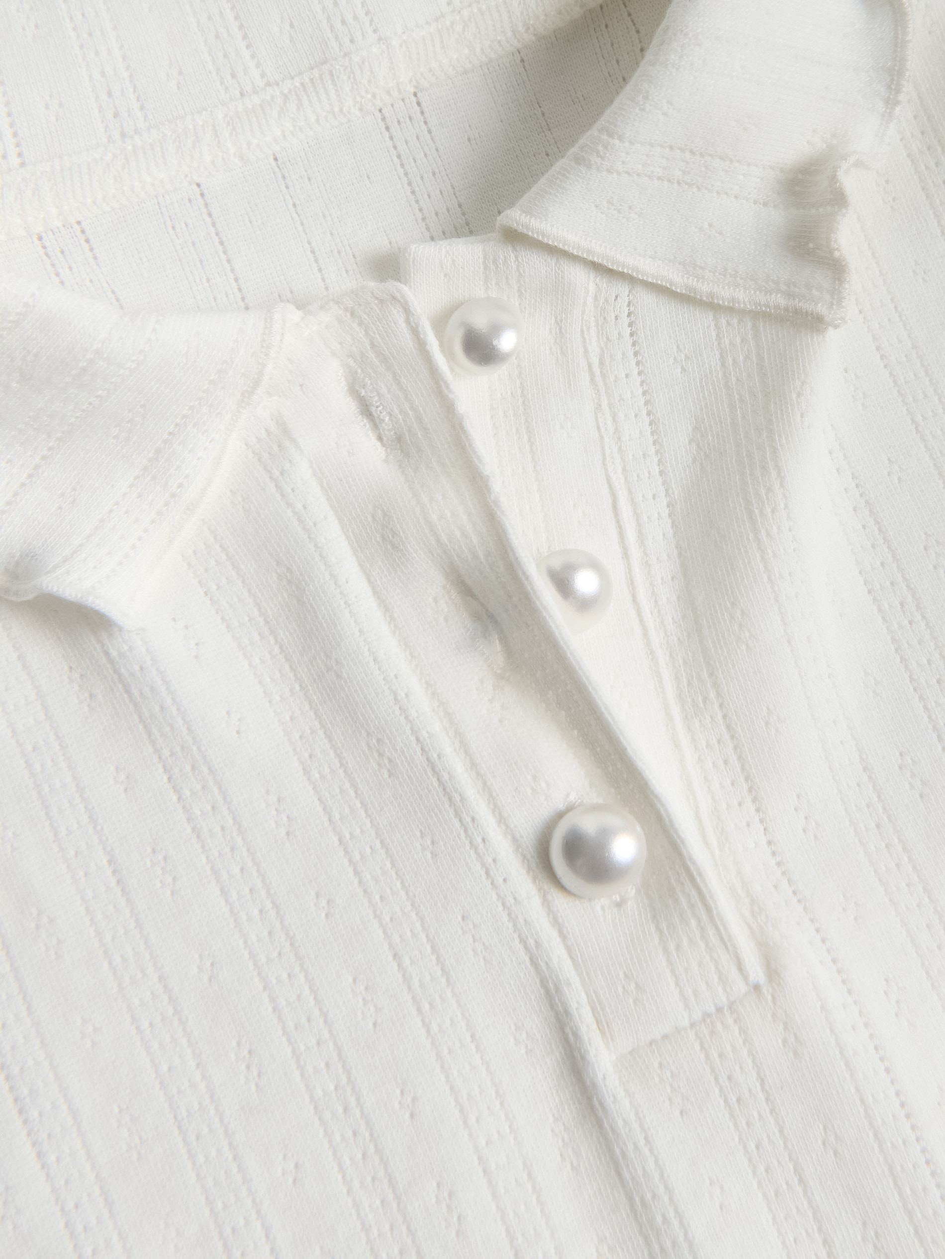 Bluse mit dekorativen Knöpfen