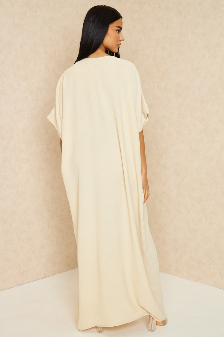 Abaya beige clair à broderies dorées