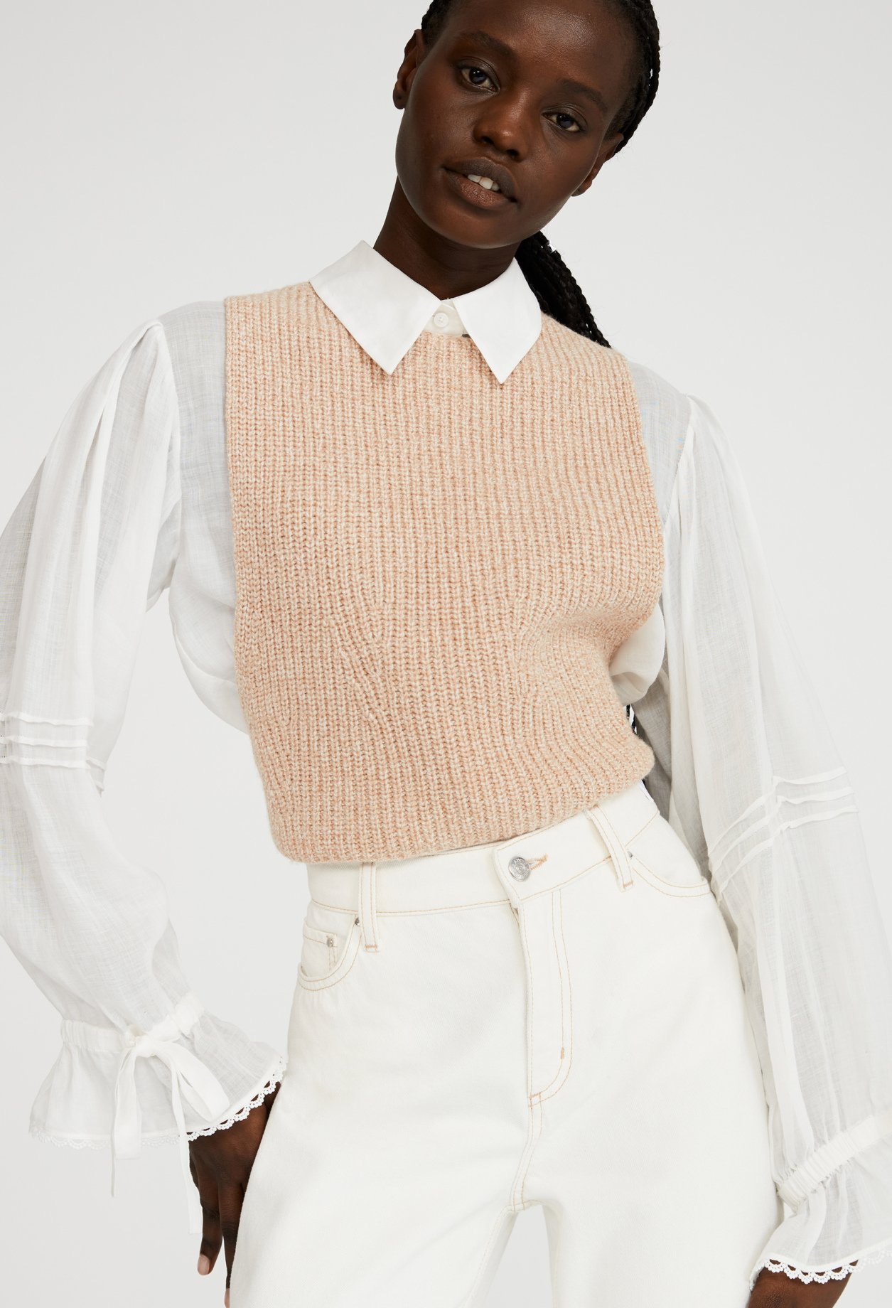Pull sans manche croise dans le dos