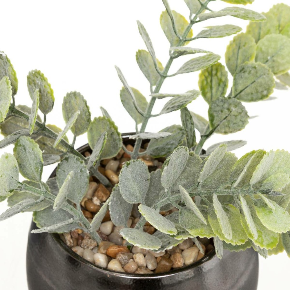 Plante artificielle dans un pot en céramique noire effet réactif