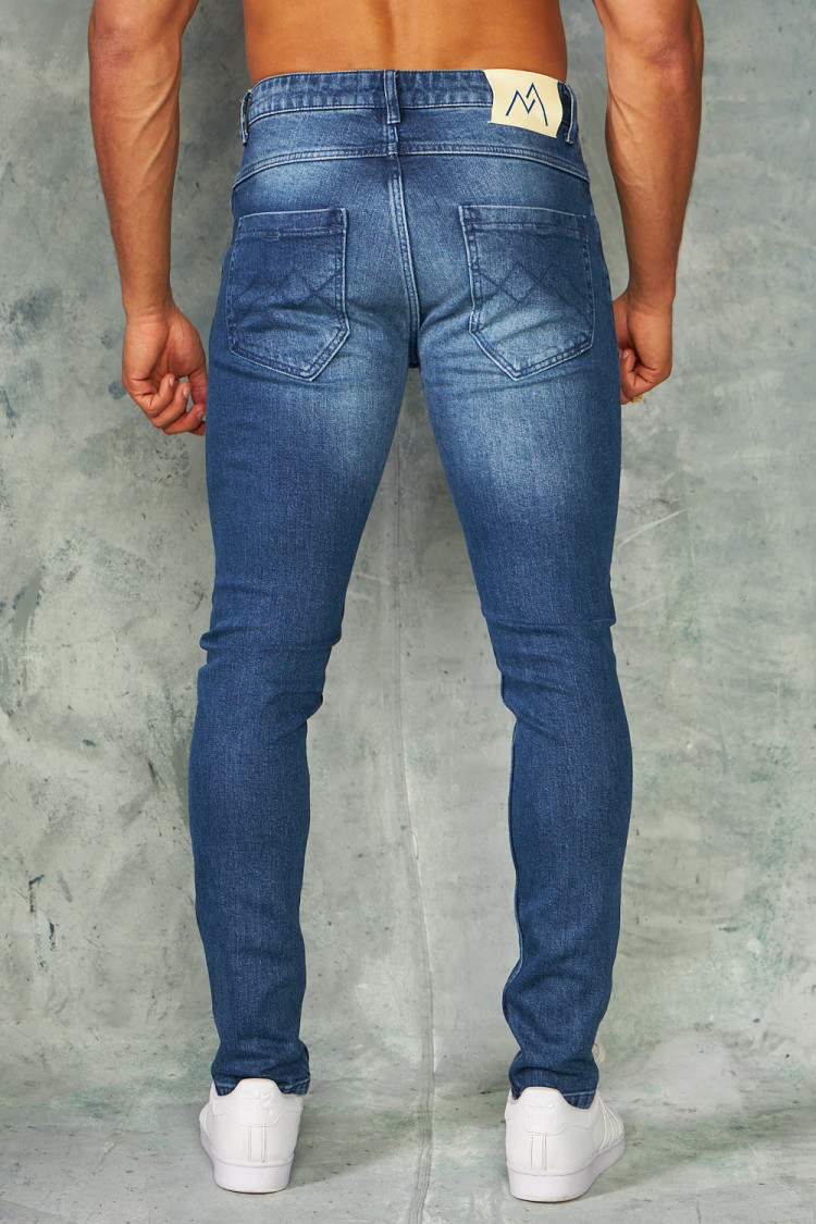 Jeans slim bleu foncé délavé déchiré