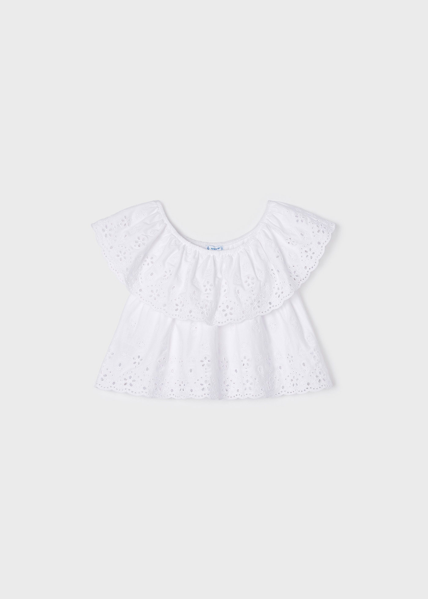 Blusa com motivos perfurados, feita de algodão sustentável, para meninas.