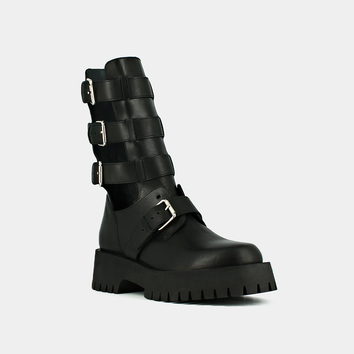 Boots à sangles et semelles crantées  en cuir noir