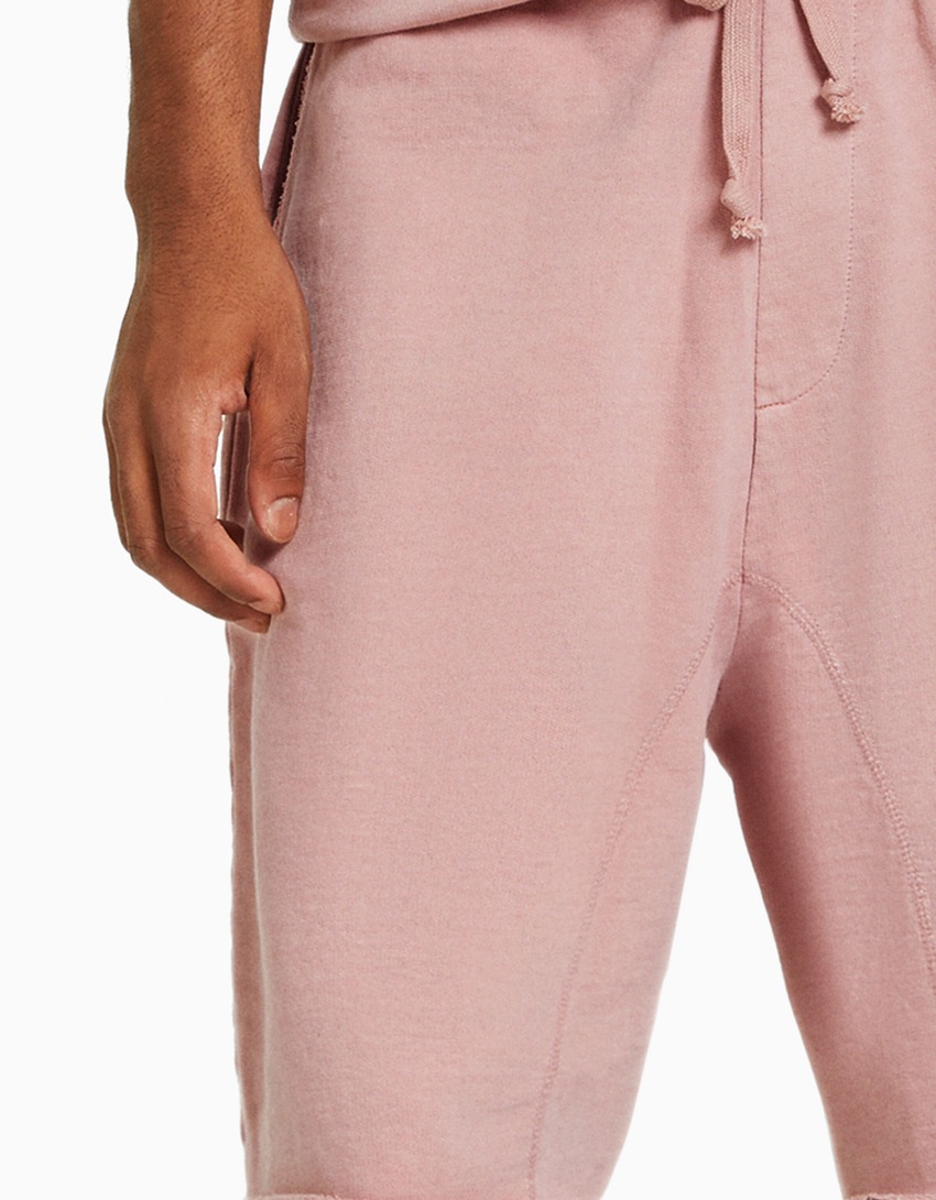 Bermudas de pelúcia com efeito desbotado